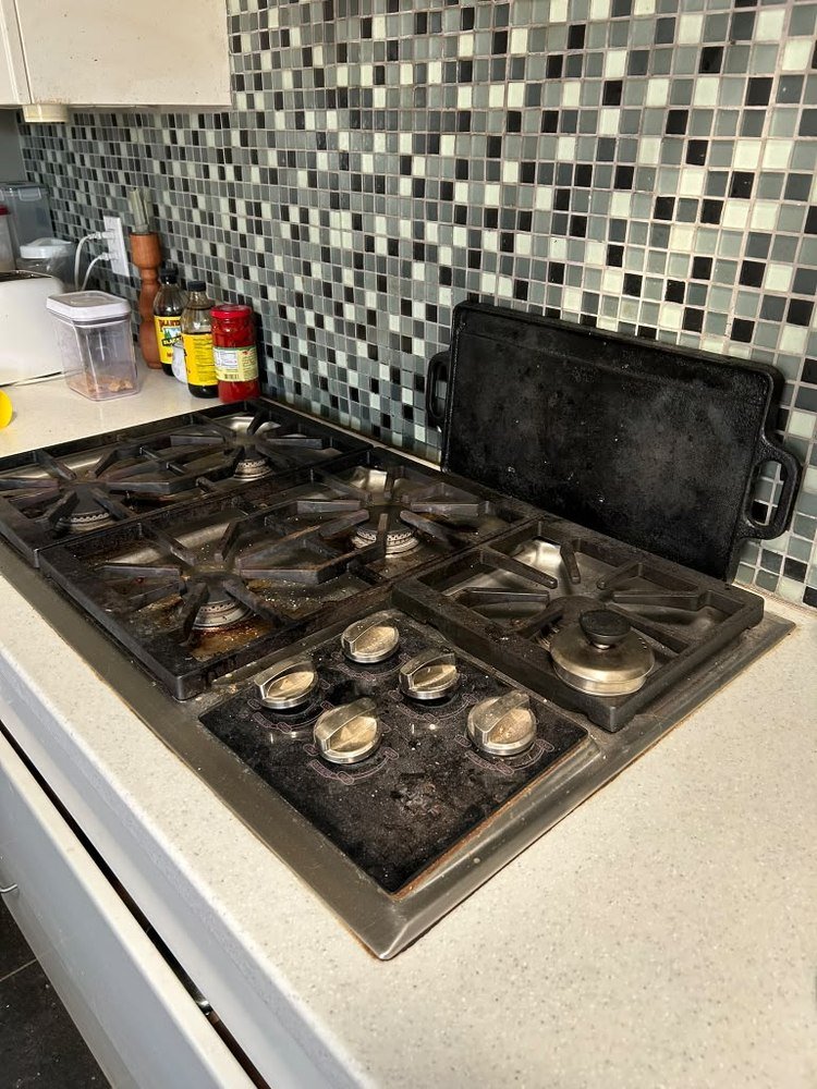 Stovetop before deep cleaning